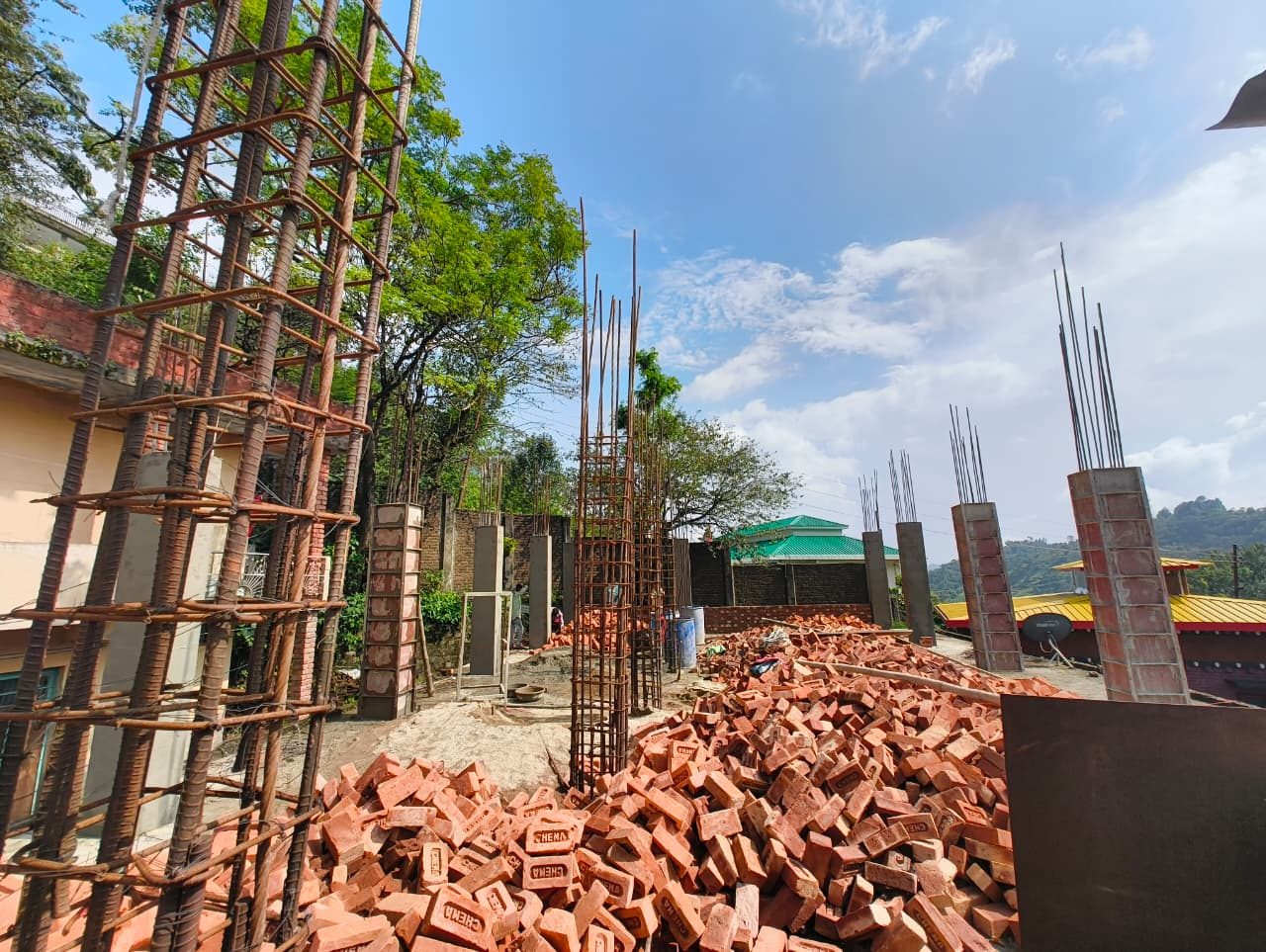 Brick and reinforced-concrete column work at the Phase 1A construction site