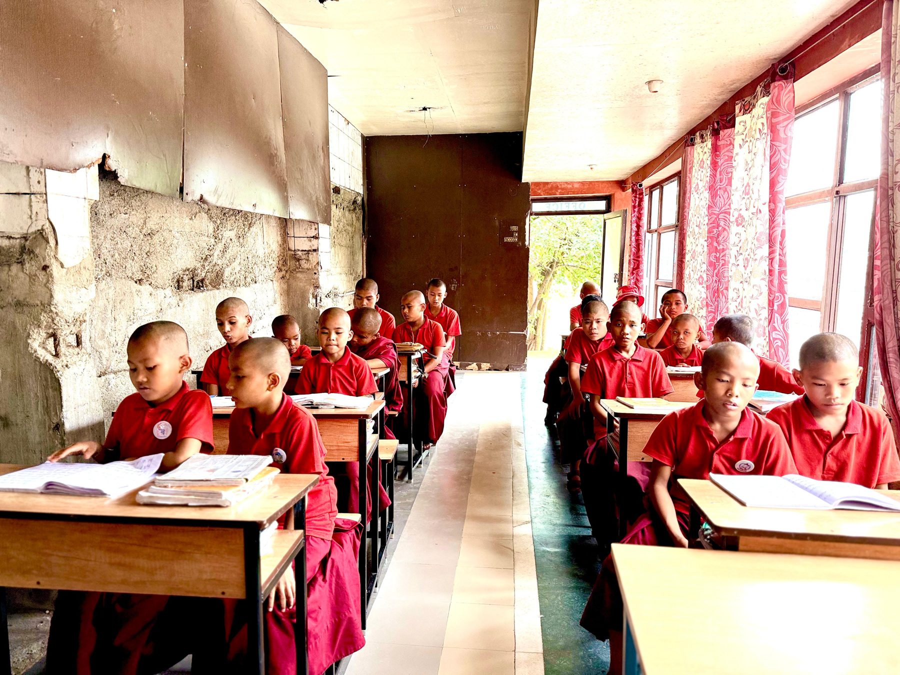 Young monks studying together in their current classroom